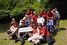 Scott Maslen from EastEnders with staff and children from Kent Kids Miles of Smiles