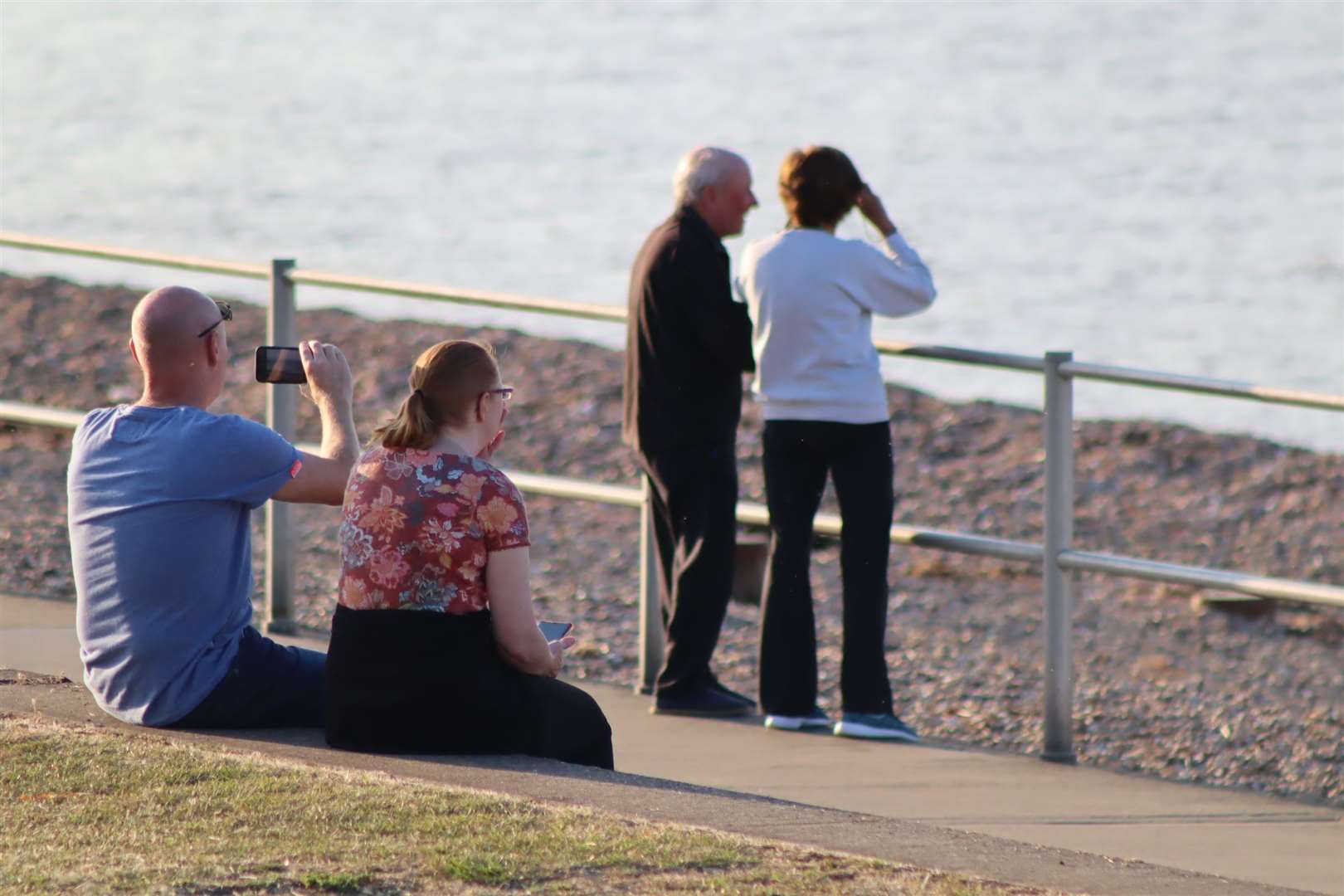 Sightseers watch the world's biggest container ship HMM Algeciras off Minster beach, Sheppey. Picture: John Nurden