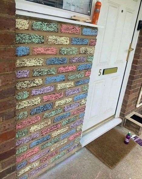 The rainbow wall was proudly on display on the front of their flat in Park Wood