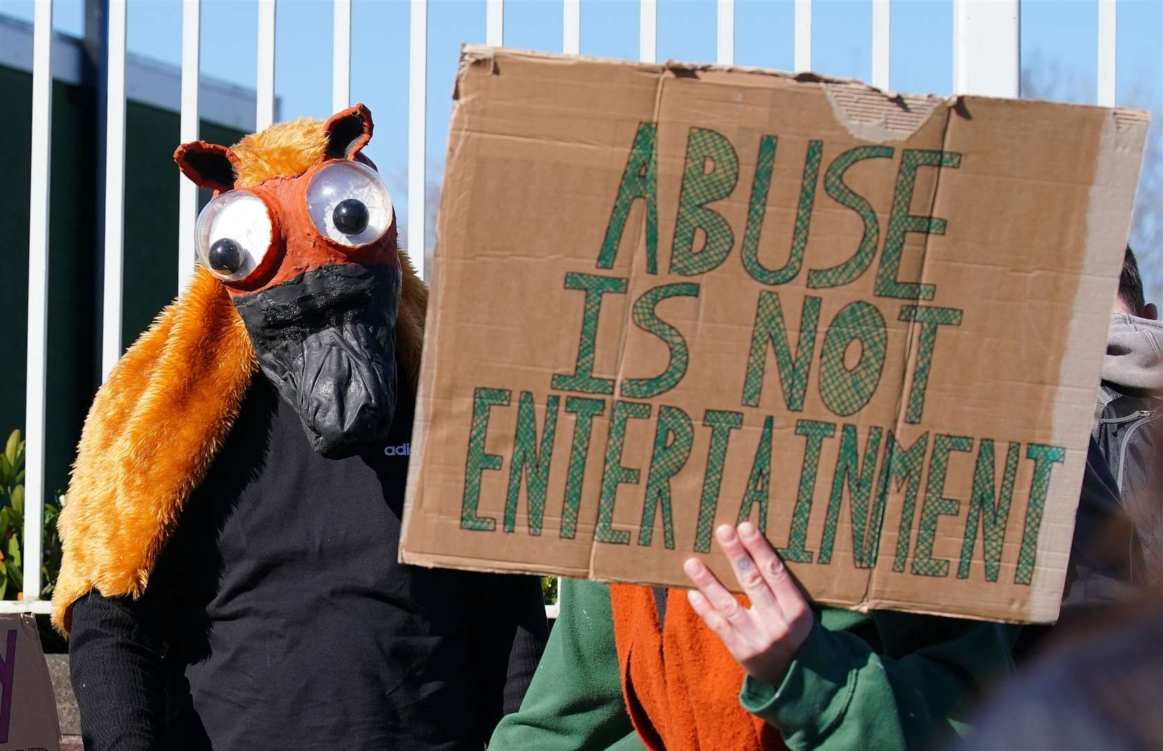 Activists outside the gates ahead of day three of the Randox Grand National Festival (Peter Byrne/PA)