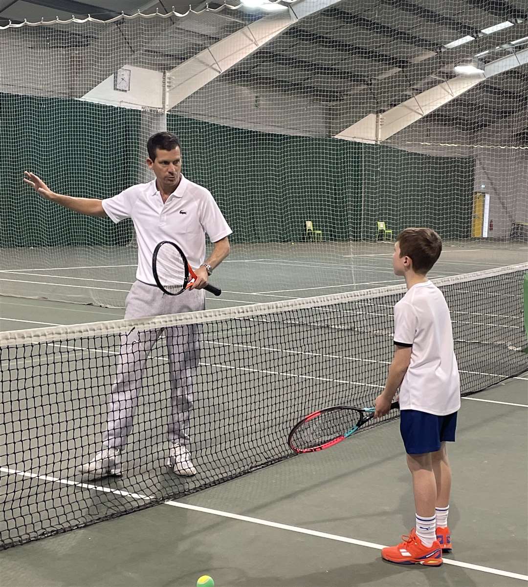 Tennis star Tim Henman helped Sam Dennison improve his preparation and serve