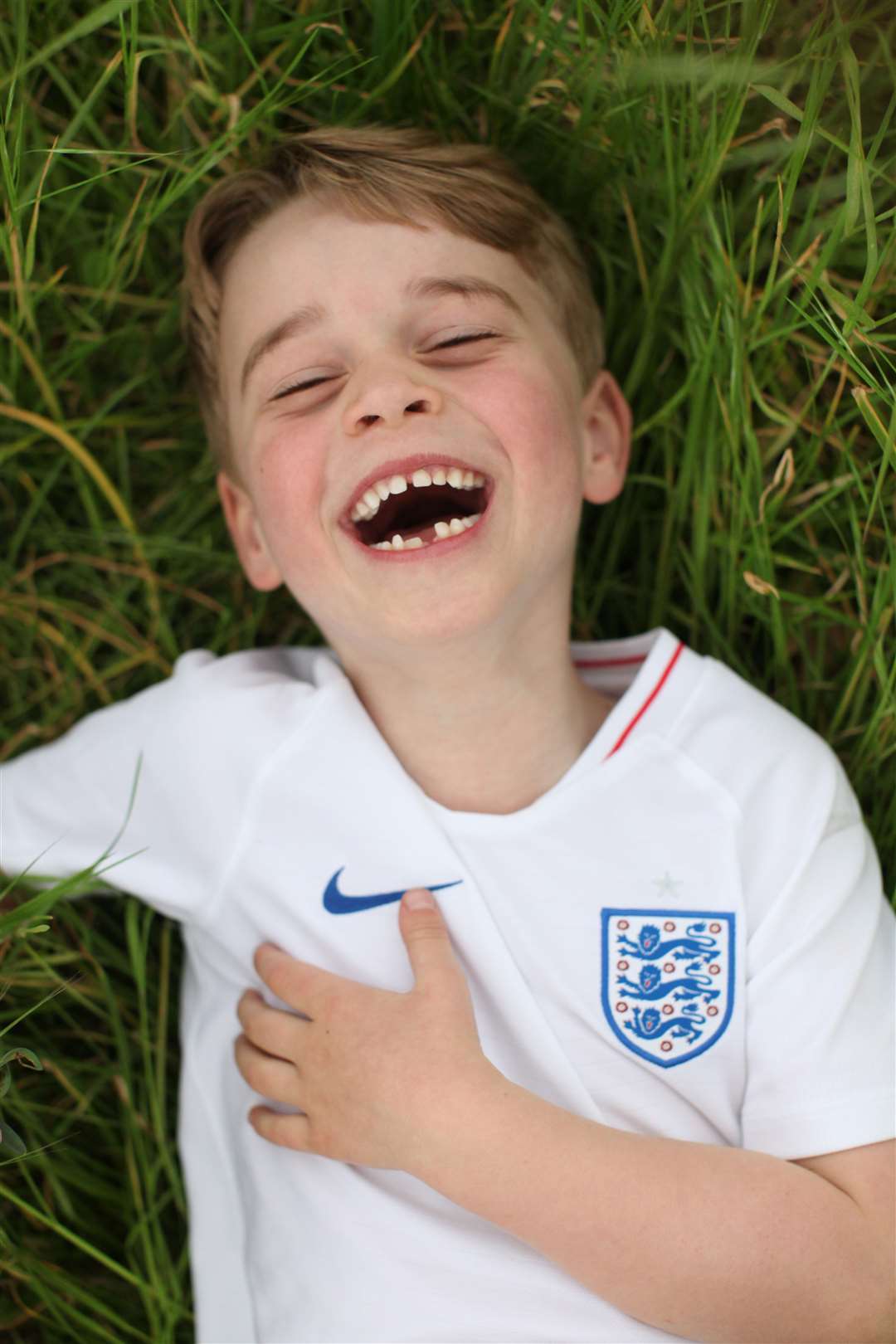 George the England football fan in the garden of his home at Kensington Palace in a picture marking his sixth birthday (Duchess of Cambridge/PA)