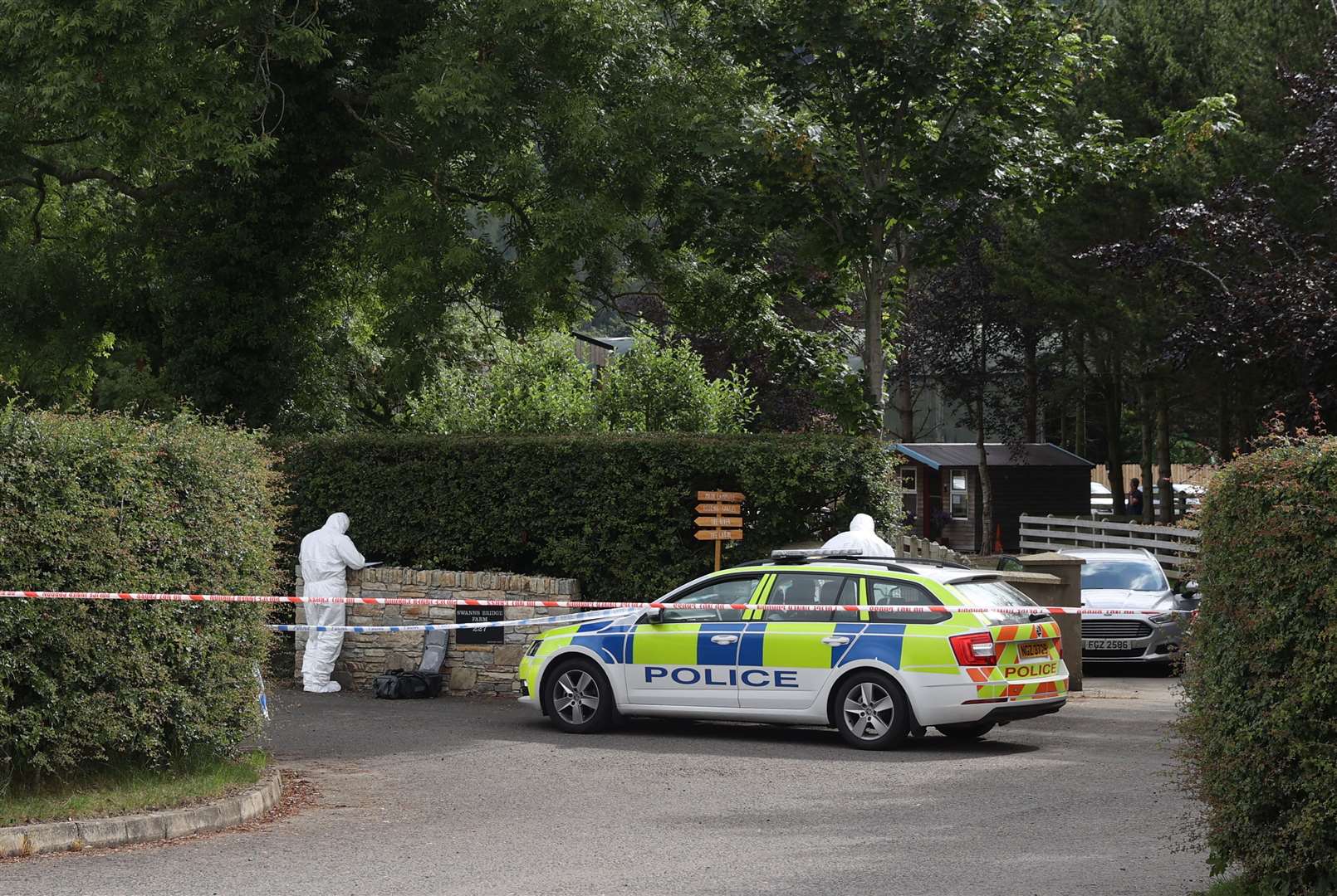 Forensic officers at the scene (Liam McBurney/PA)