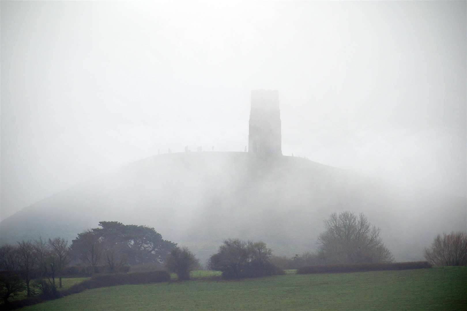 Foggy conditions at St Michael’s Tower on top of Glastonbury Tor, Somerset, ahead of New Year celebrations (Ben Birchall/PA)