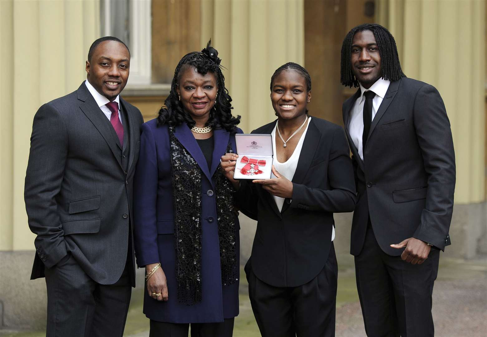 Nicola Adams, pictured with her family including her mother, after being made an MBE (Jonathan Brady/PA)