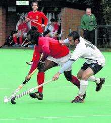 Canterbury player-coach Kwan Browne (red) in action against Surbiton