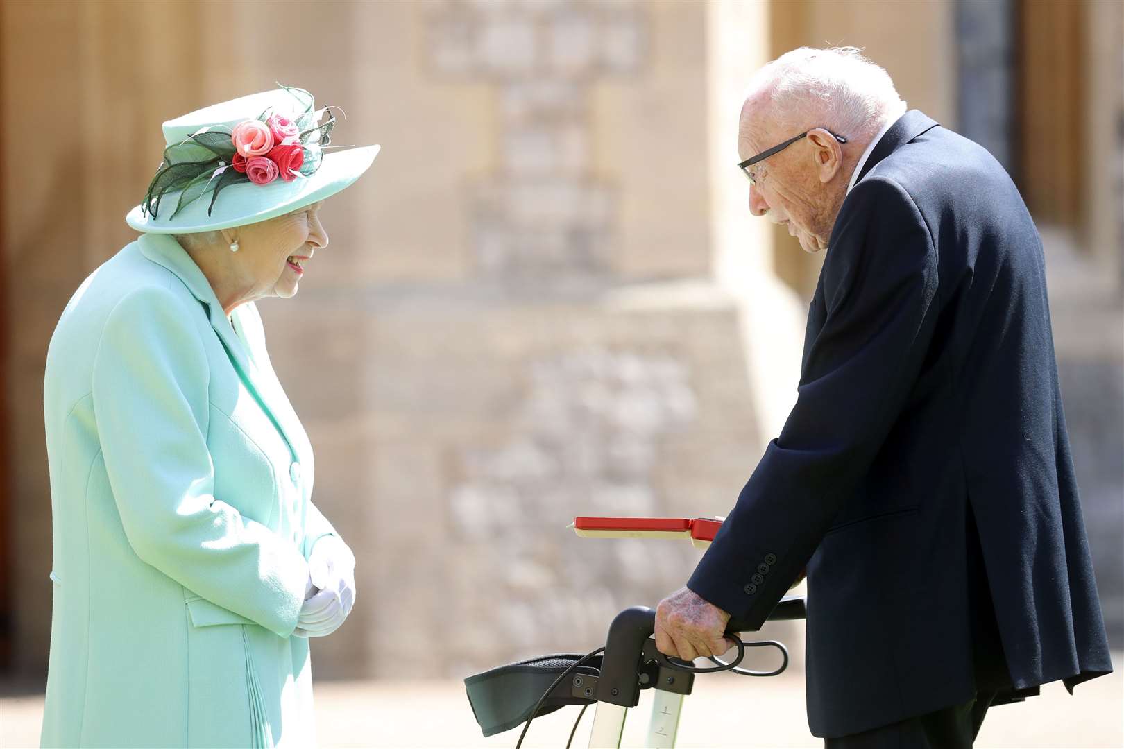 Captain Sir Tom Moore receives his knighthood from the Queen (Chris Jackson/PA)