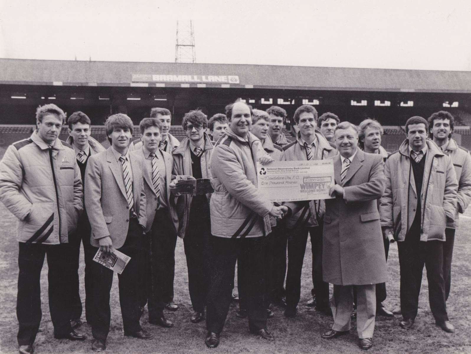 A cheque presentation to Maidstone United on the pitch at Bramall Lane.