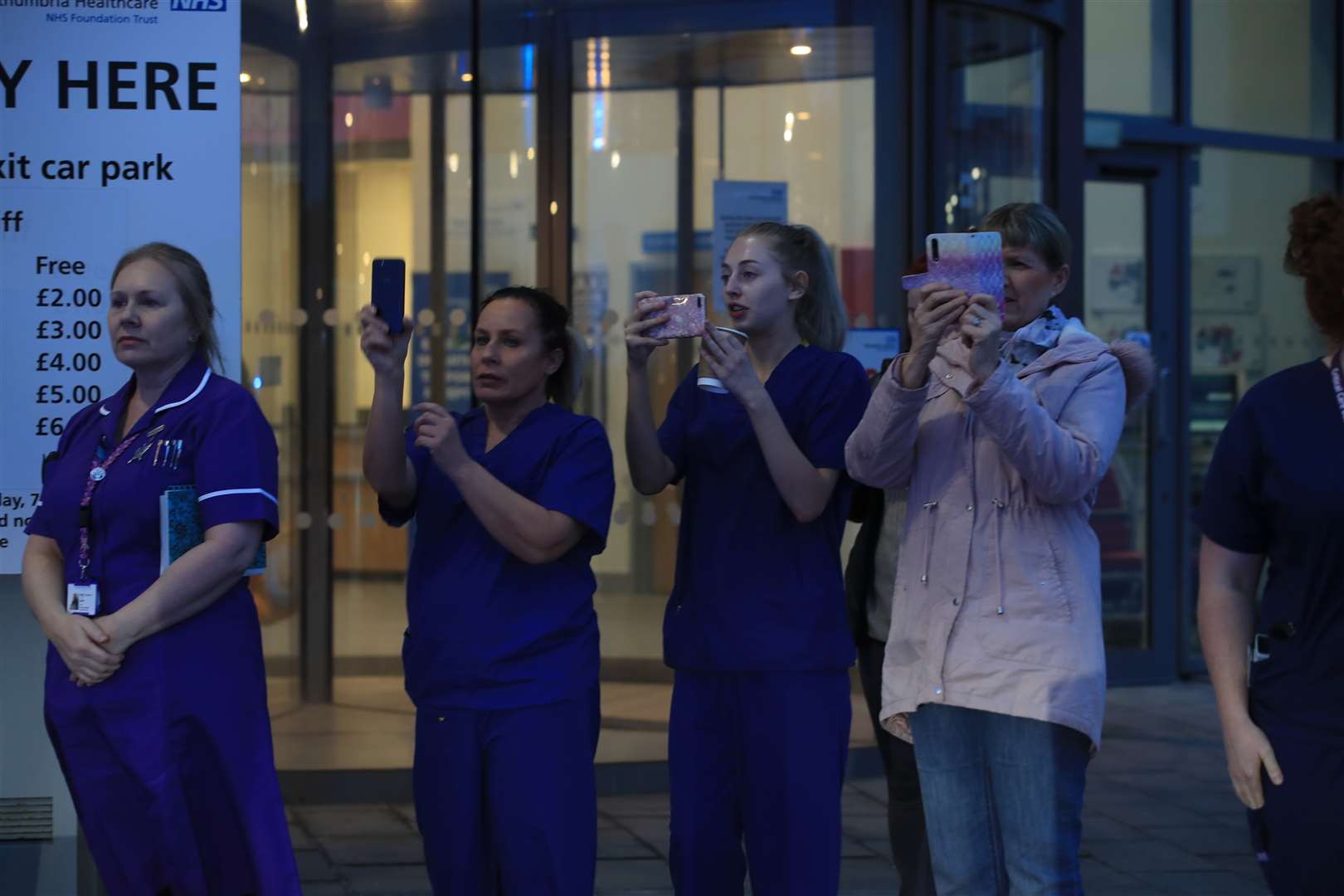 NHS workers at Cramlington Hospital in Northumberland film members of the Northumberland Fire and Rescue service applauding (Owen Humphreys/PA)