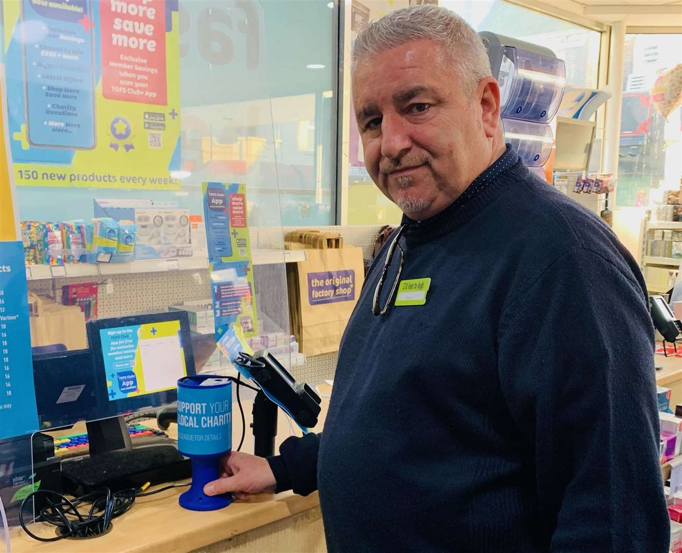 Store boss Wayne Richardson with a remaining charity pot. Picture: The Original Factory Shop