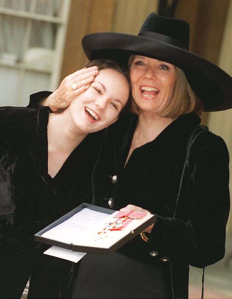 With 17-year-old daughter Rachael, at Buckingham Palace, where she was made a Dame Commander of the British Empire (PA)