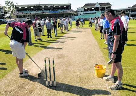 Groundstaff work on the track at the St Lawrence Ground