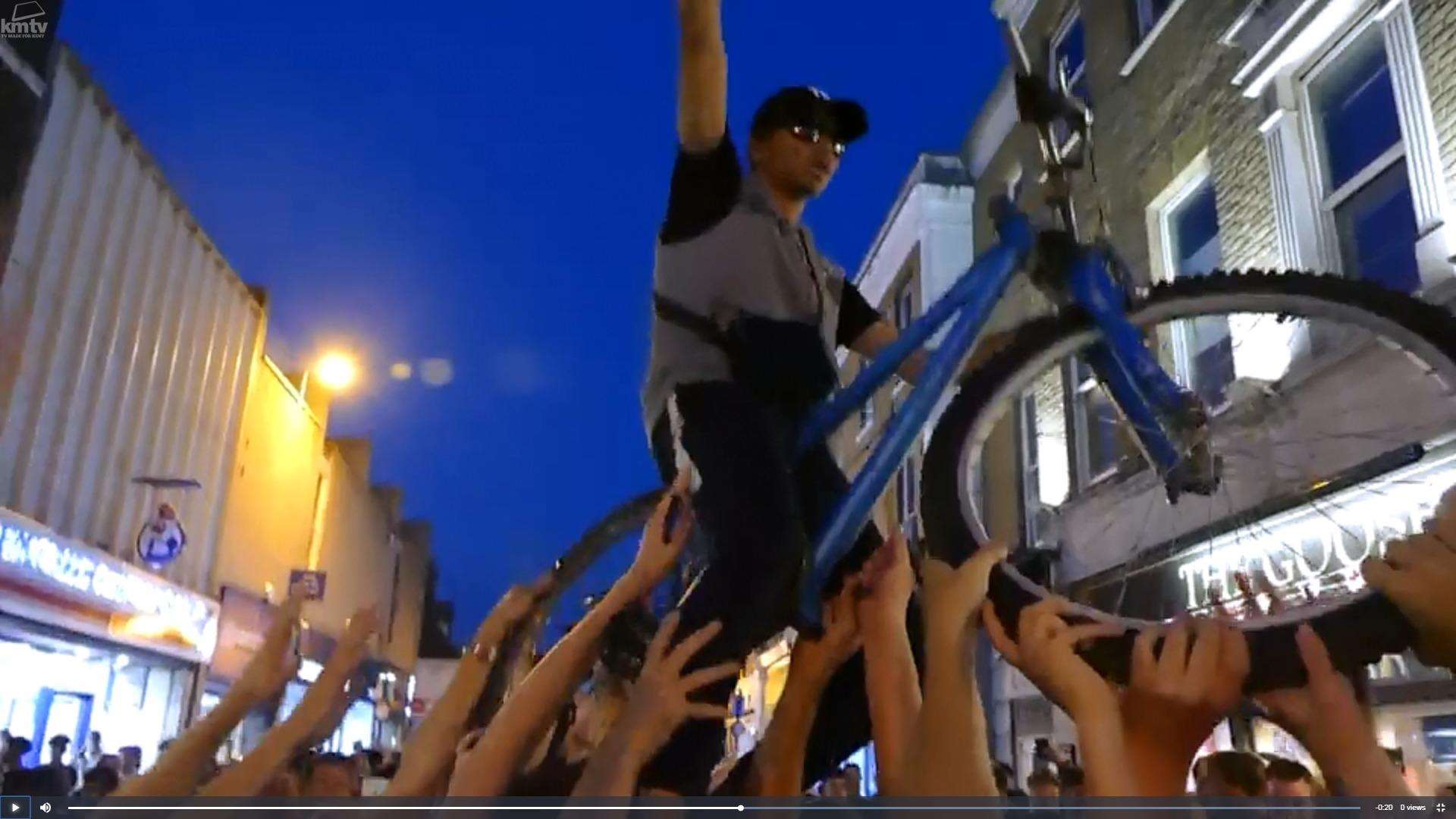 Fraser Gray captures the moment a cyclist was lifted up by England fans