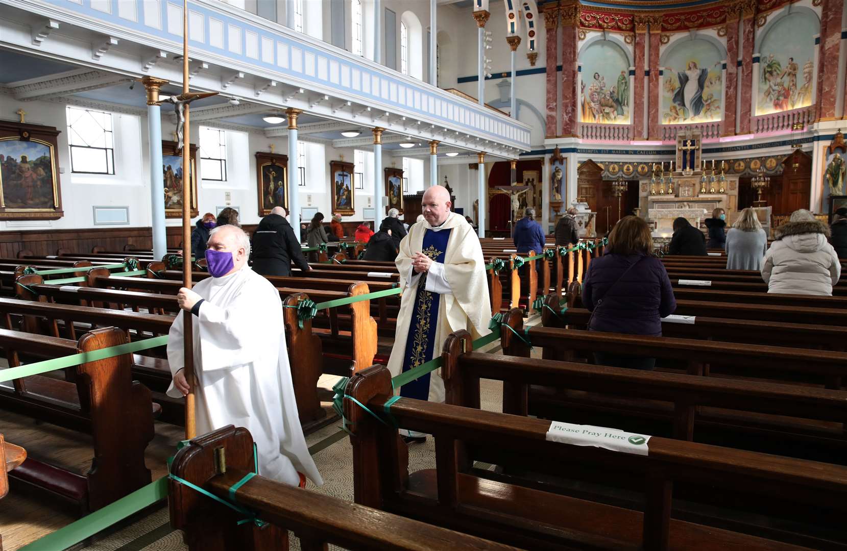 Canon Tom White led the first mass at his church since being permitted to reopen (Andrew Milligan/PA)