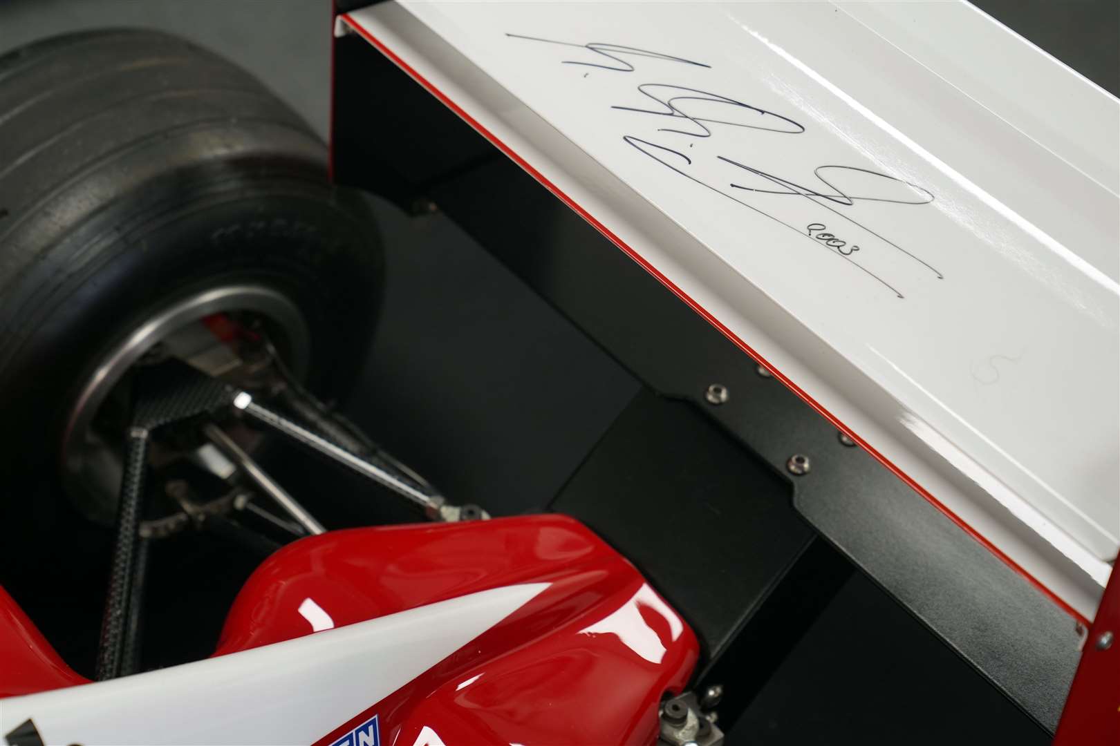 Michael Schumacher signed the rear spoiler of the remote-controlled car (Joe Giddens/PA)