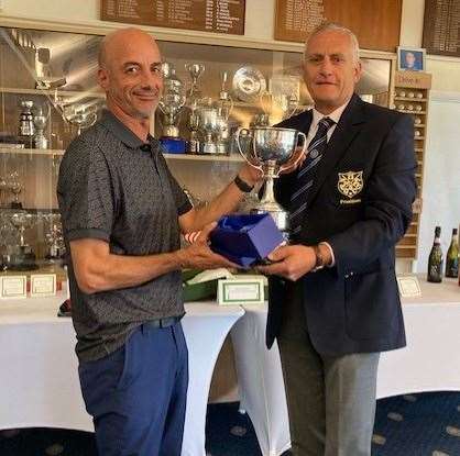 Ian Hinson, left, receives the Cecil Leitch trophy from Paul Mosdell, president of host club Sheerness