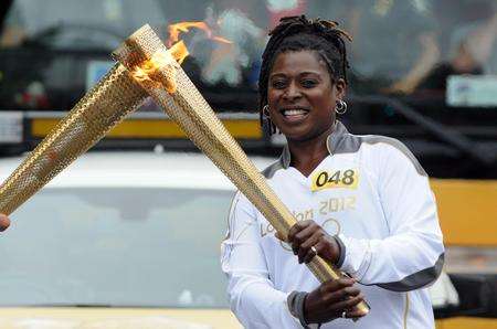 The Olympic torch relay is handed over in Hythe. Picture: Wayne McCabe