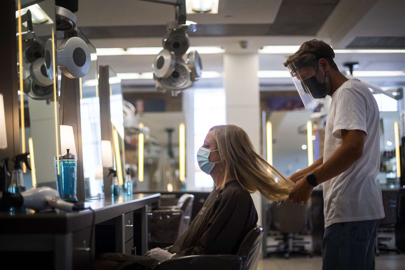 Hair salons and barbers can reopen on July 15 (PA)