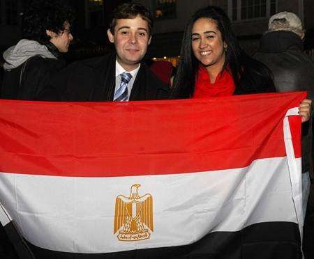 Mostafa Osman and Sondos Arafa celebrate the change of leadership in their country.