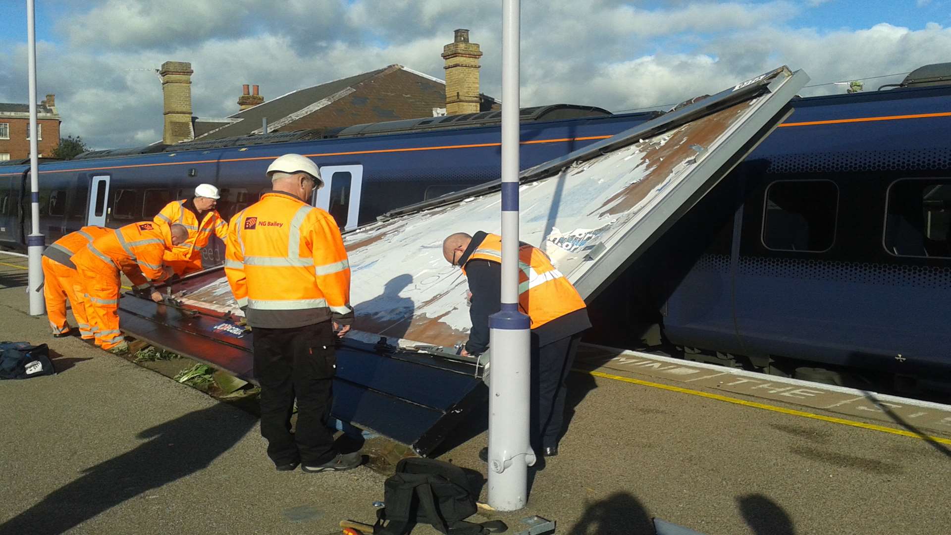 An advertising board hits a train at Faversham station