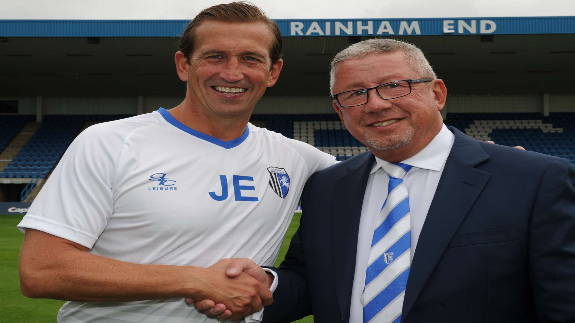 Former manager Justin Edinburgh with Gills chairman Paul Scally in August Picture: Steve Crispe