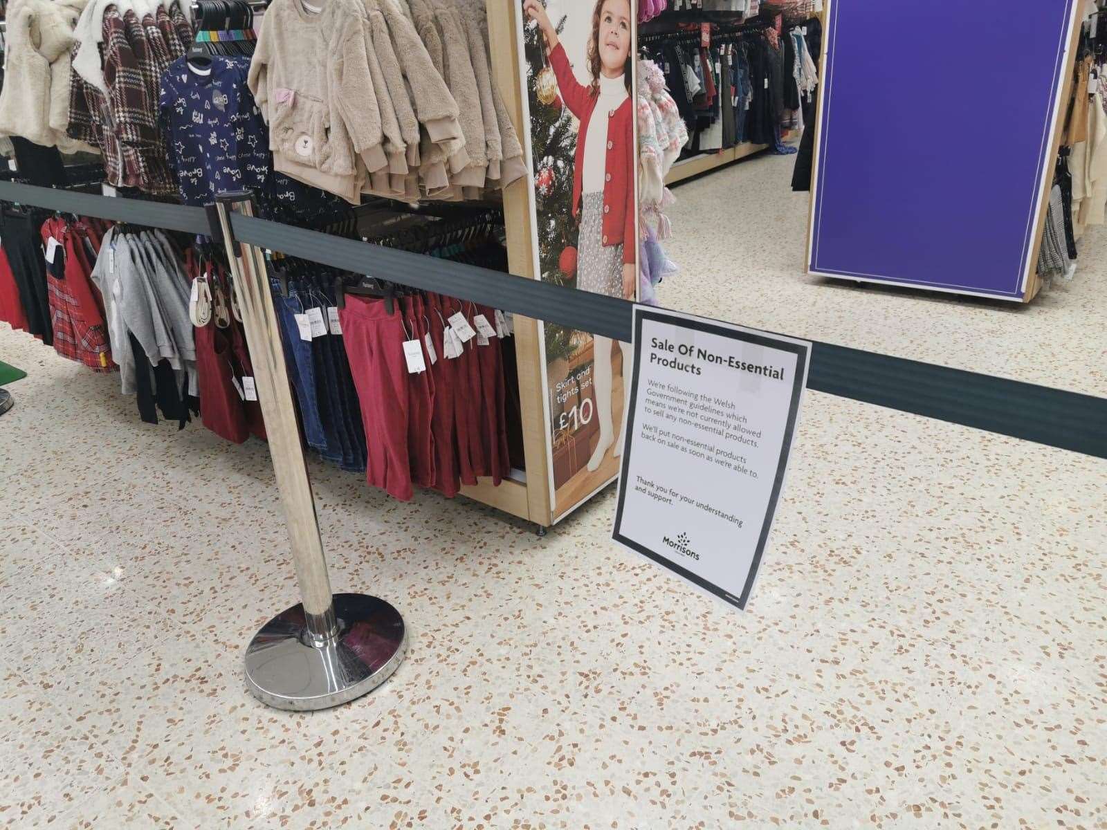 A notice informing customers of the sales of non-essential products in a Morrisons store in Cardiff Bay (Adam Hale/PA)