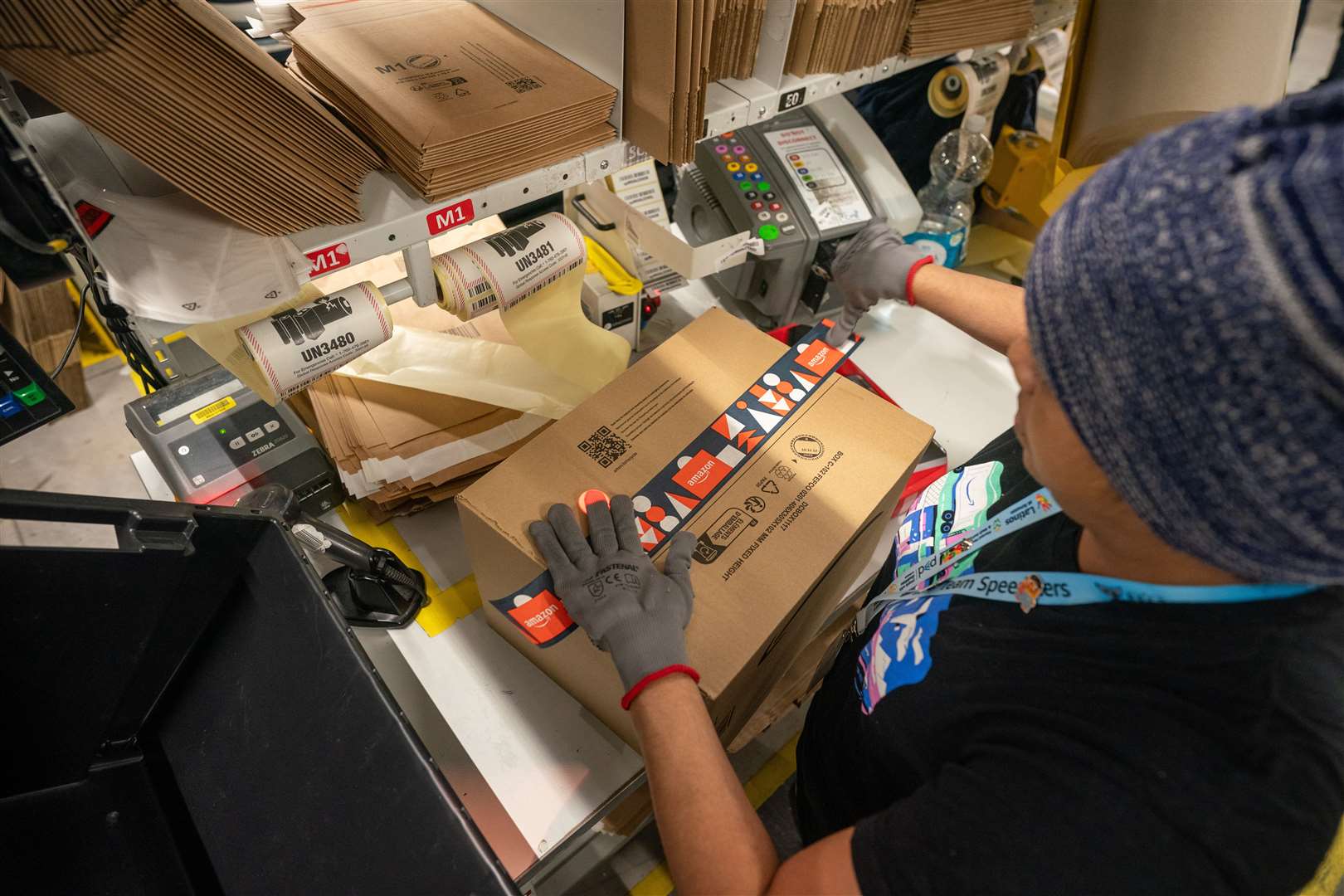 Amazon workers prepare to ship items (Ben Birchall/PA)