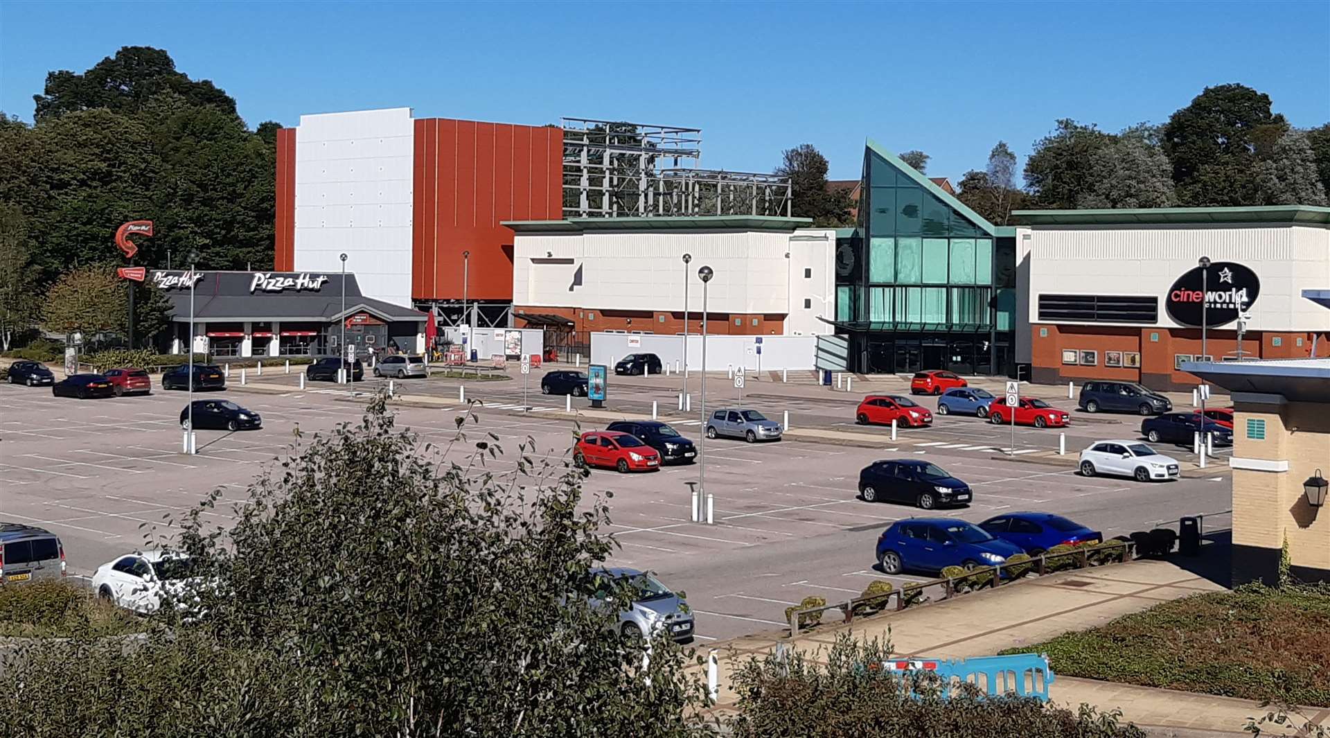 The IMAX and 4DX extension towers over Pizza Hut and the original part of the cinema