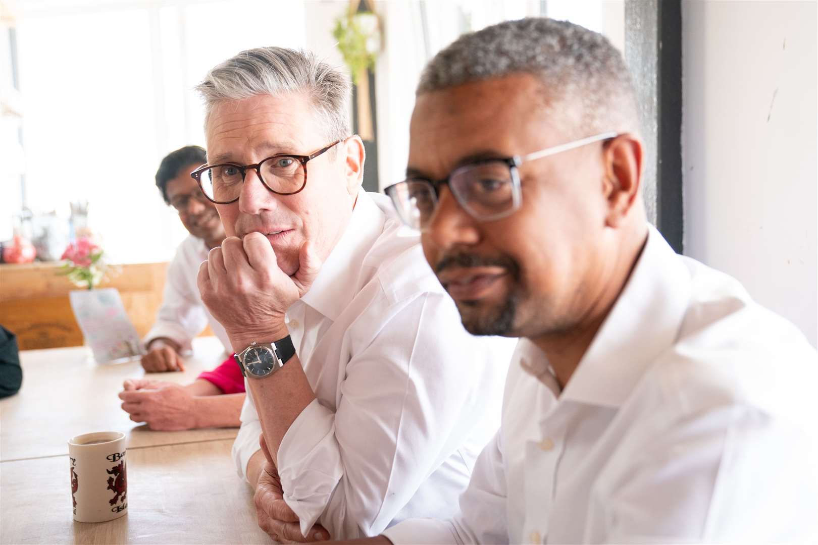 Wales First Minister Vaughan Gething with UK Labour Party leader Sir Keir Starmer in a cafe on Barry seafront (Stefan Rousseau/PA)