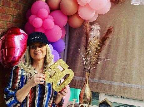 Kelly Ward wearing a wig on her 50th birthday during cancer treatment