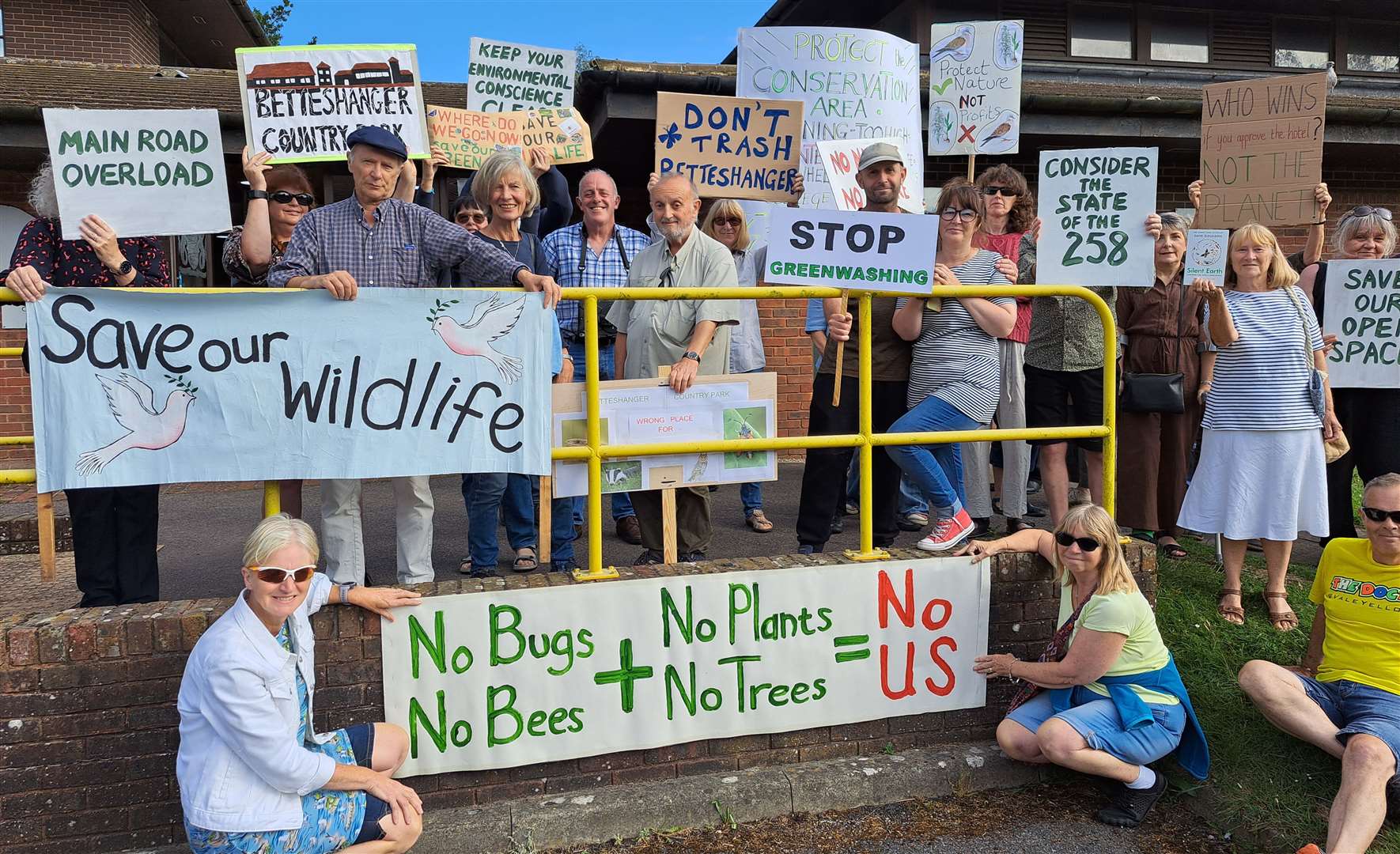 Locals against the hotel demonstrating just before the meeting