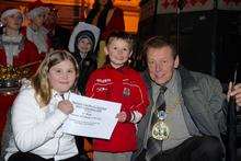 Competition winners Tyler-Gillespie Mitchell and Shannon Mitchell receive their cerificate from Mayor of Swale Cllr Adrian Crowther