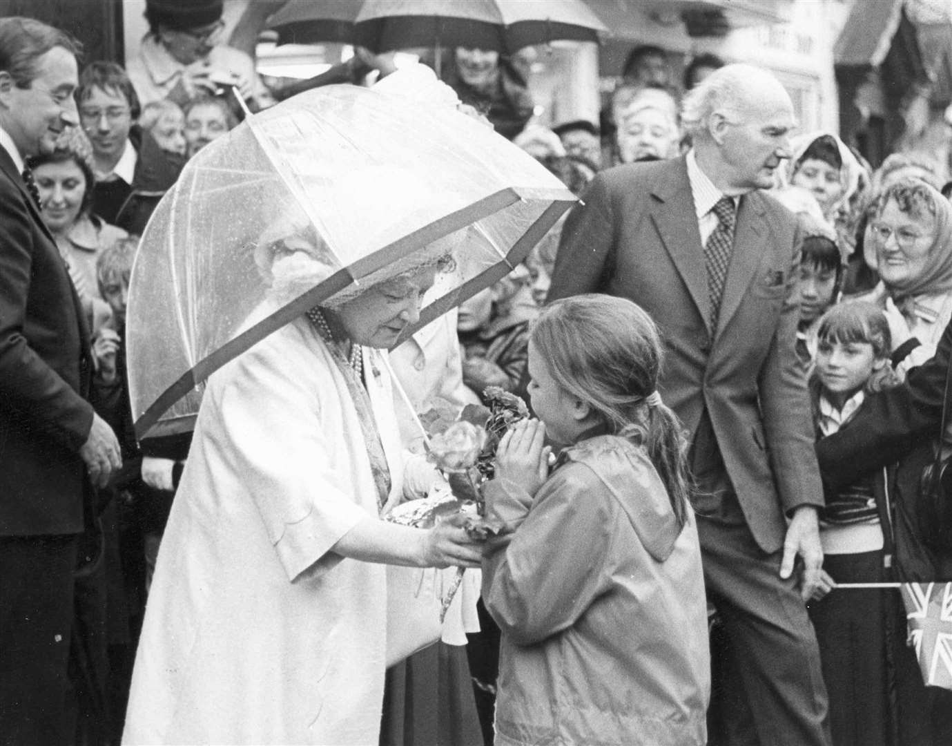 When the Queen Mother dropped into New Romney in July 1980, yhe excitement was too much for brownie Juliette Payne, nine, who stepped out of the crowd to offer a pink rose to the royal visitor, then just burst into tears. But the Queen Mother came to the rescue by reaching out sympathetically to wipe away the tears and asking kindly: ''Did you pick it in your own garden?"