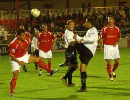 Gravesend dangerman Charlie MacDonald battles for possession. Picture: BARRY CRAYFORD