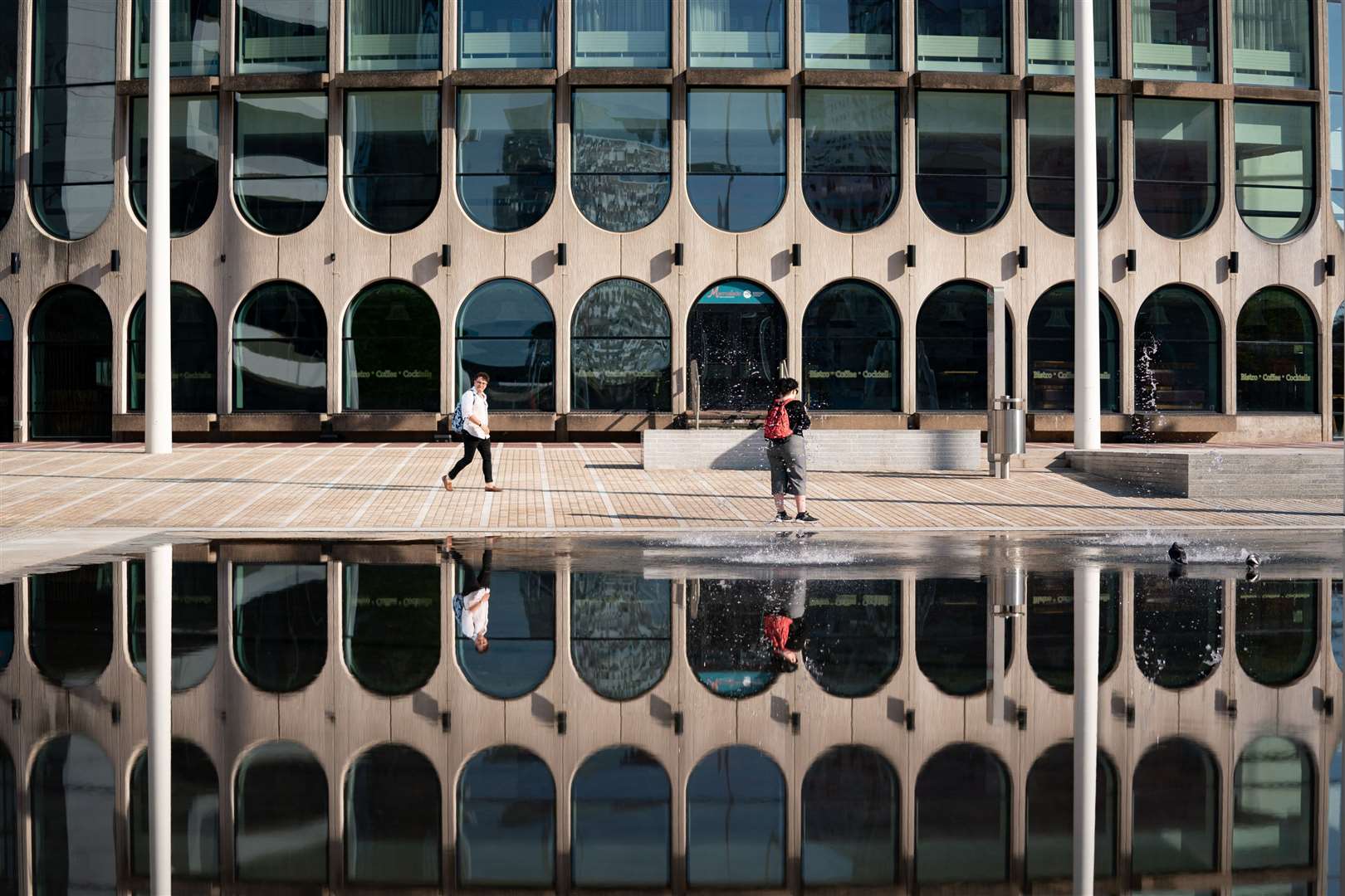 People walk by Centenary Square in Birmingham (Jacob King/PA)