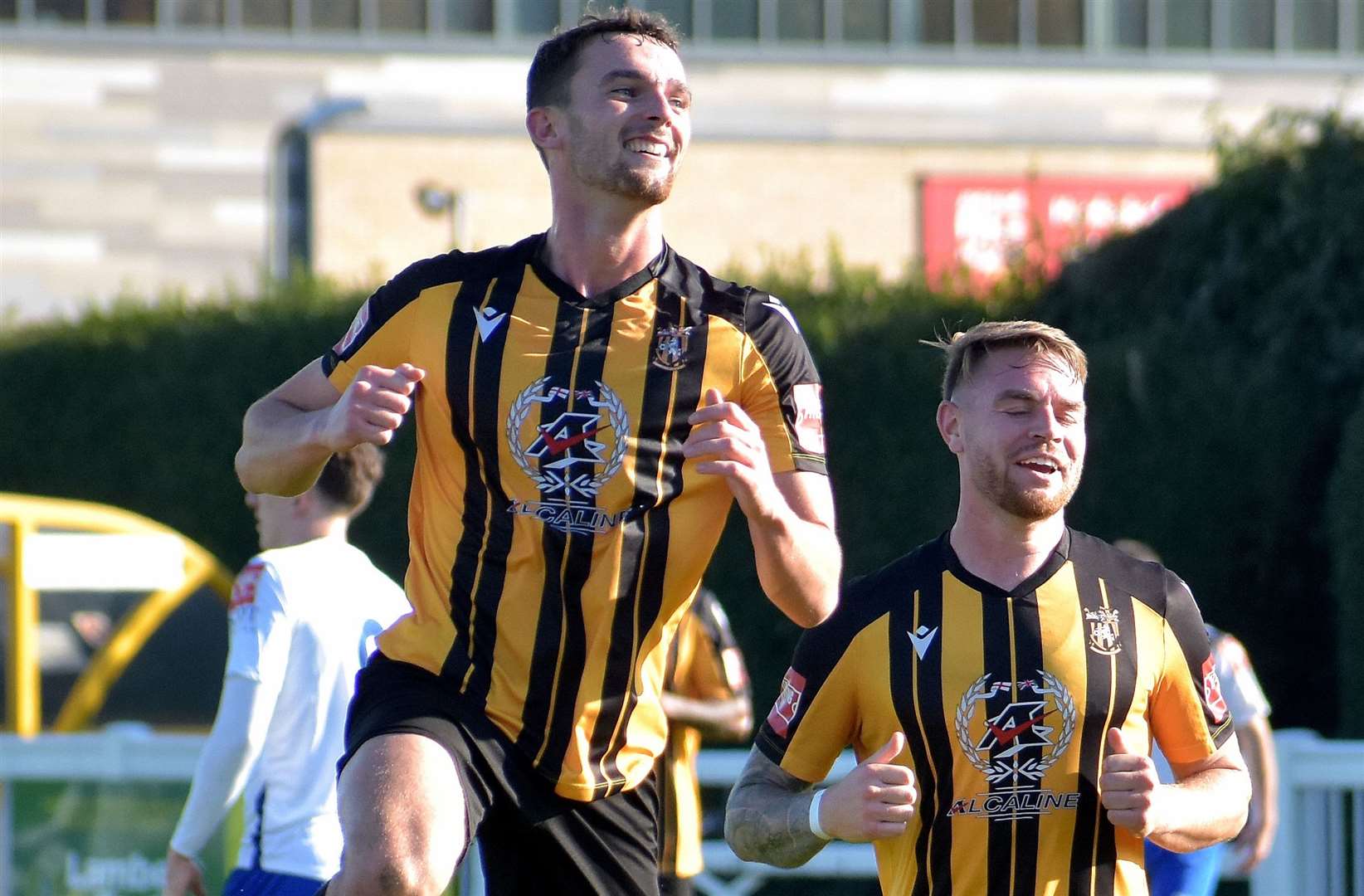 Folkestone’s Dan Smith celebrates scoring one of his three goals with midfielder Jack Jebb in their 8-1 FA Trophy third qualifying round weekend win over Ascot United. Picture: Randolph File