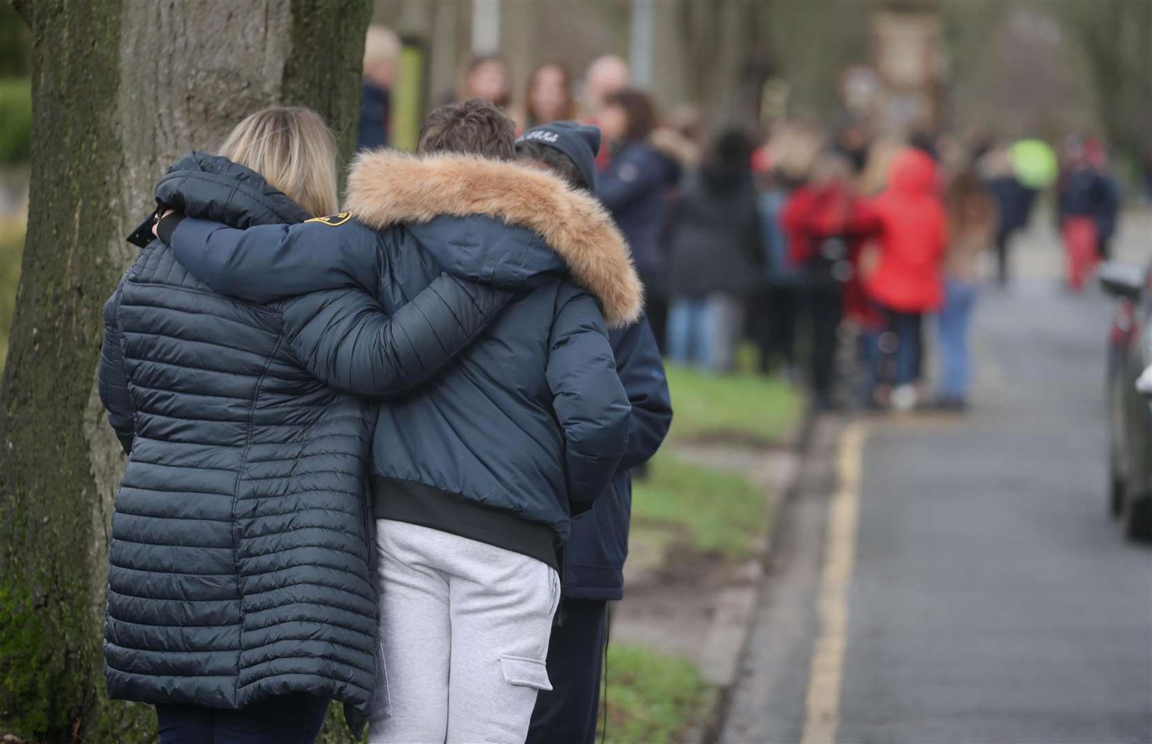 The funeral procession slowed at All Hallows Road, Reading to receive floral tributes (Steve Parsons/PA)