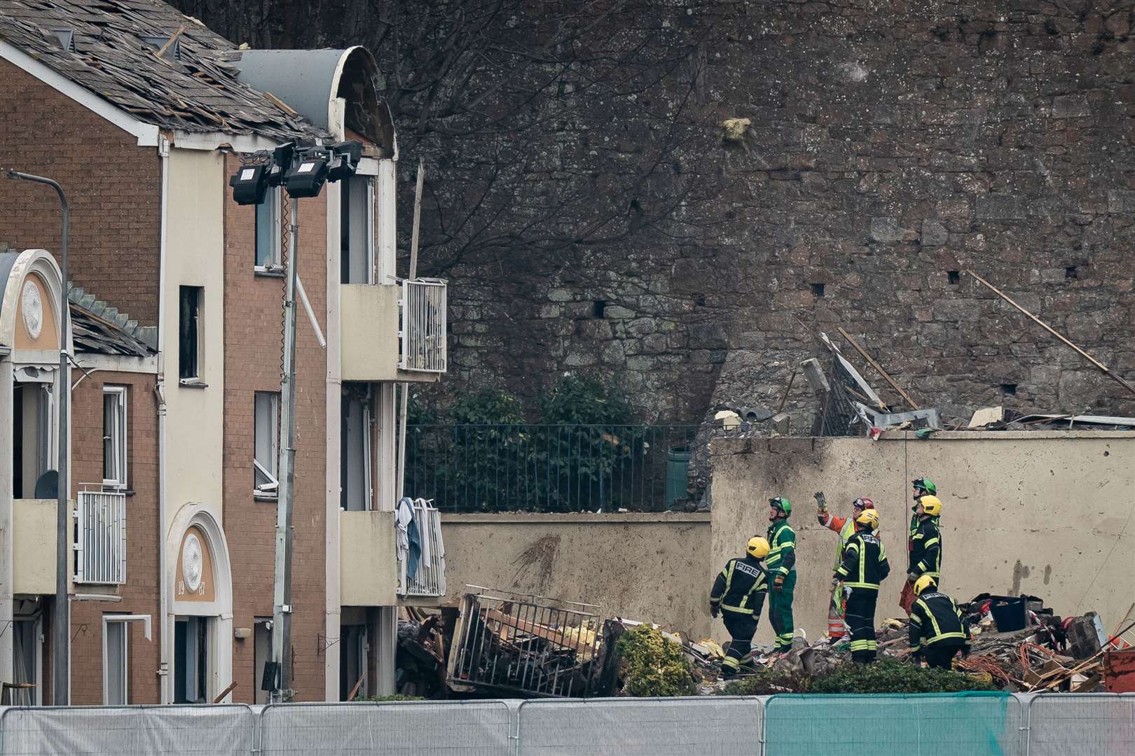 Specialist rescue teams at the scene of the explosion in St Helier (Aaron Chown/PA)