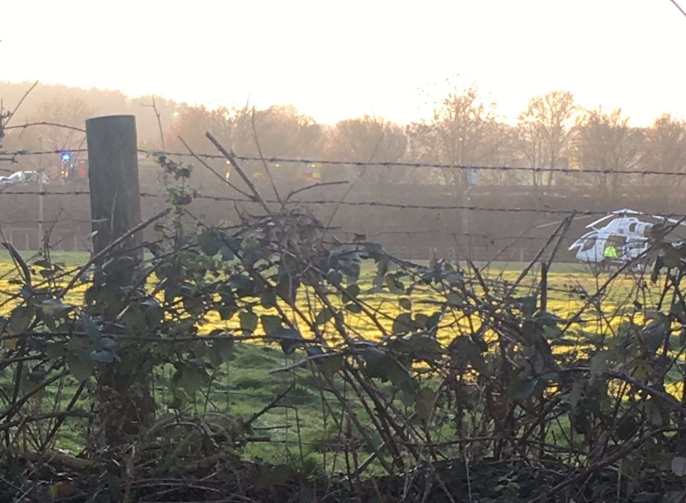 The air ambulance landed in a field near the A21. Picture: Lauren Pomfret