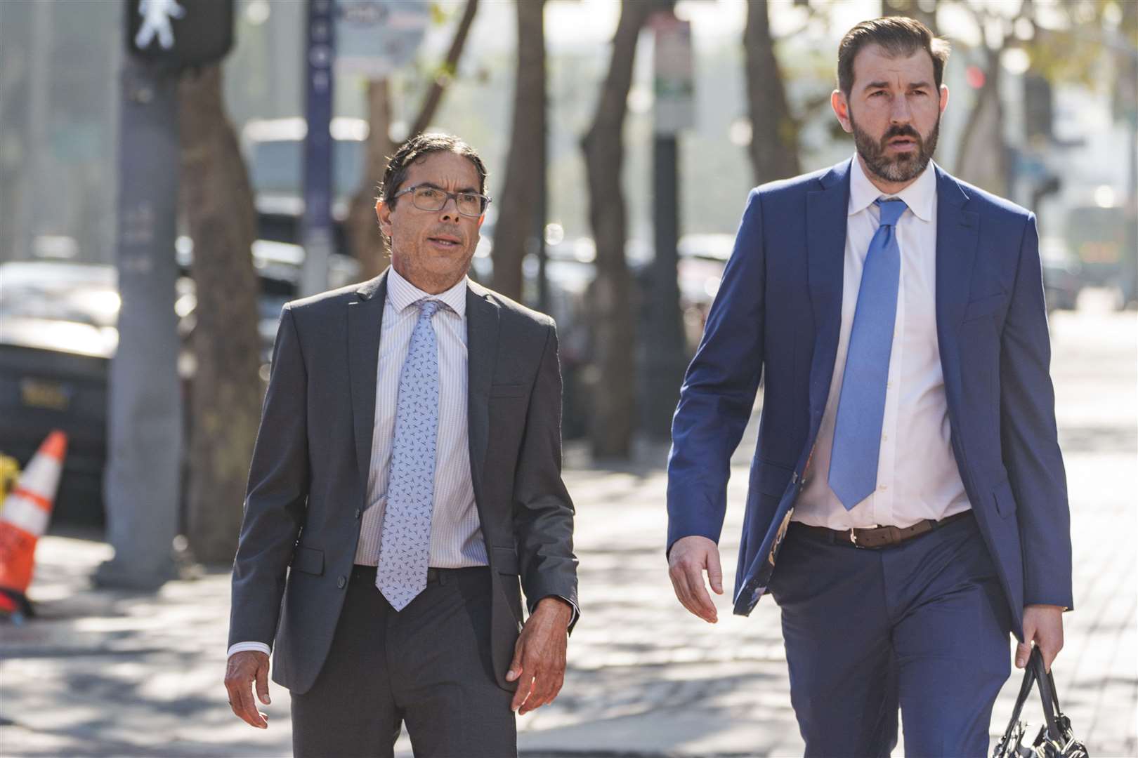 Mark Chavez (left) with his lawyer Matthew Binninger (Damian Dovarganes)