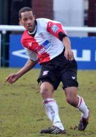 Welling boss Jamie Day, right, closes down former Wings defender Tony Sinclair on Saturday