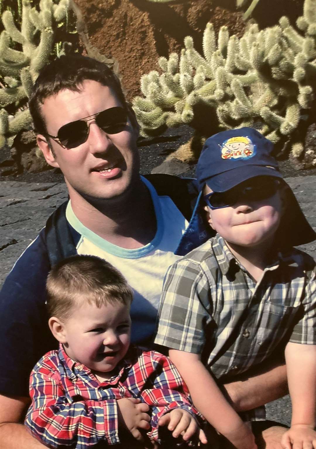 Alistair Wilson with his sons as children (Wilson Family/PA)