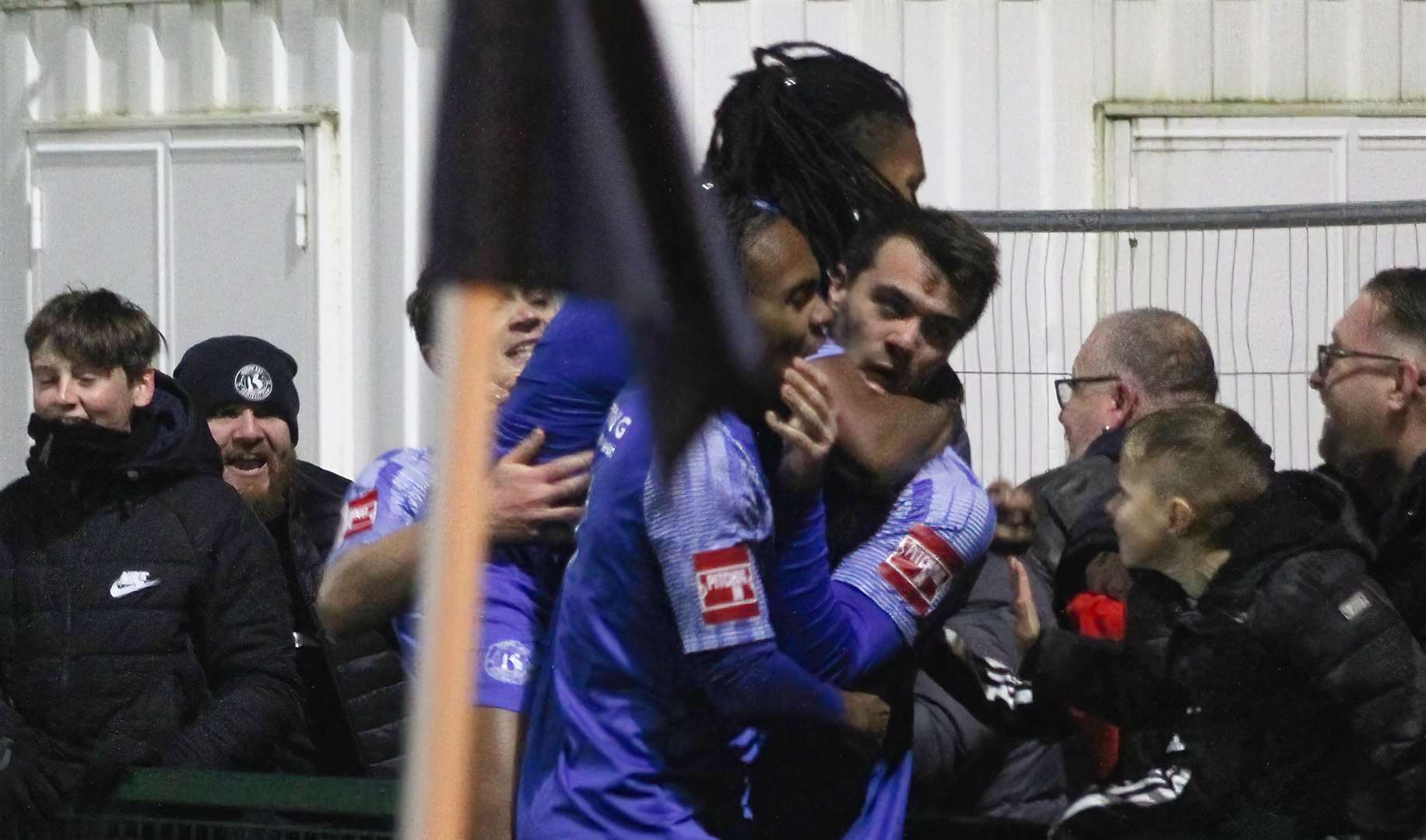 Herne Bay defender Dan Johnson shares his goal celebrations with his team-mates and the crowd in the weekend 1-1 draw with Wingate & Finchley. Picture: Keith Davy