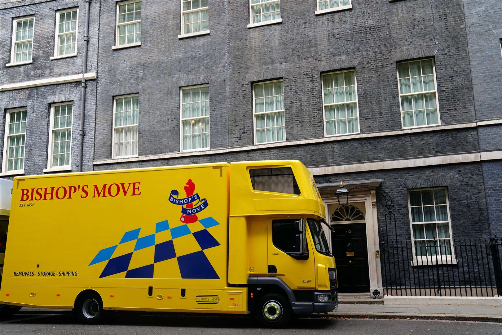 A van from the company Bishop’s Move, which specialises in removals, storage and shipping, in Downing Street (Victoria Jones/PA)