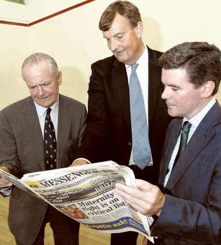 Sports Minister Hugh Robertson, right, KCC leader Paul Carter and, left, KCC cllr Mike Hill look over the Kent Messenger’s Kent School Games coverage