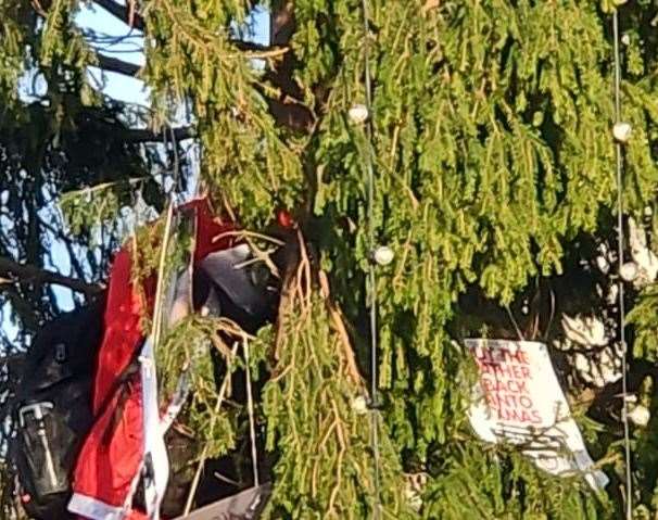 A man has been charged after a protestor was seen climbing the Christmas tree at Trafalgar Square on Sunday. Picture: Fathers4Justice