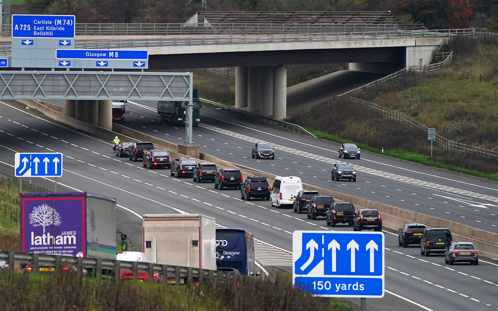 The motorcade of US President Joe Biden heads along the M8 motorway towards the Cop26 summit in Glasgow after he arrived at Edinburgh Airport (Andrew Milligan/PA)