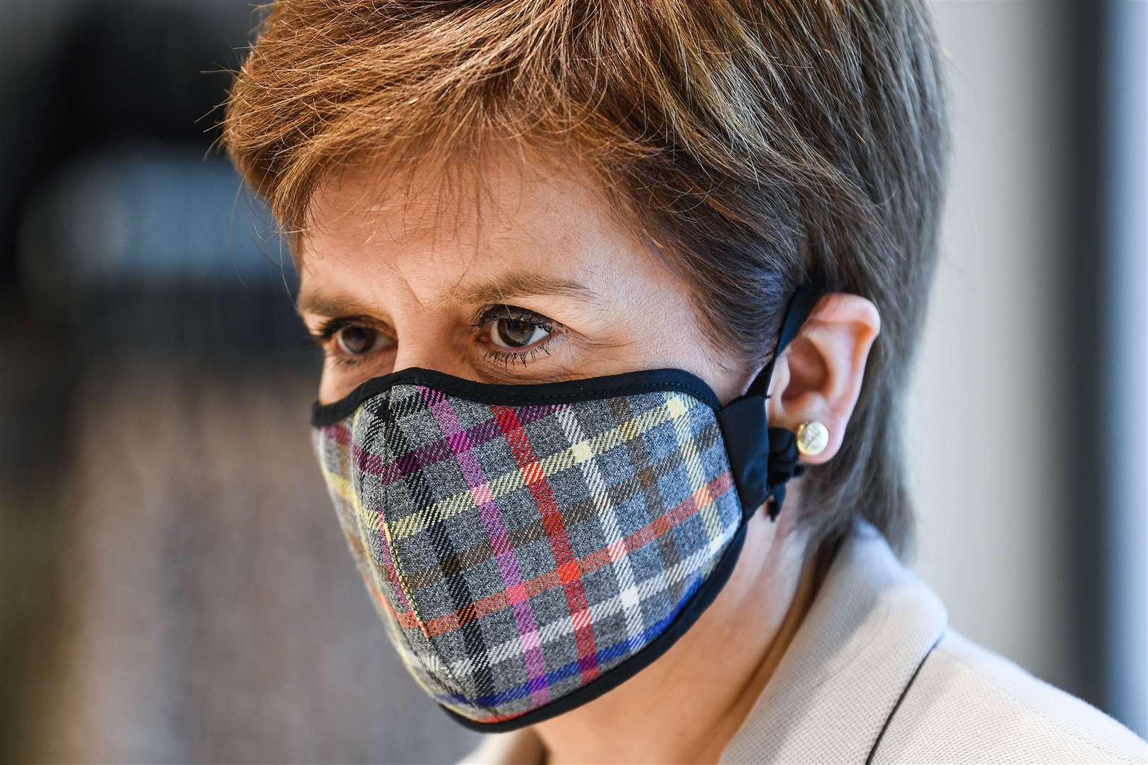 First Minister Nicola Sturgeon wearing a Tartan face covering during a visit to New Look in Edinburgh (Jeff J Mitchell/PA)