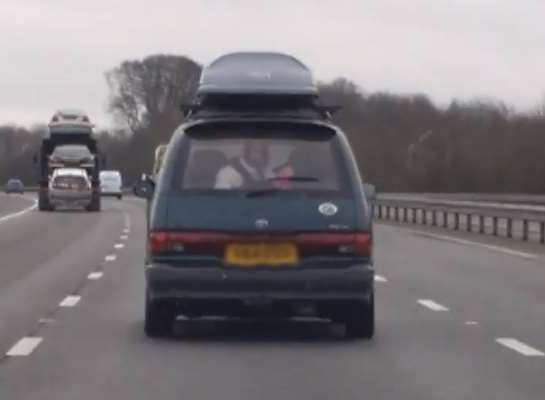 A series of clips appear to show two people bouncing around in the back of the Toyota while travelling at speed on the M20