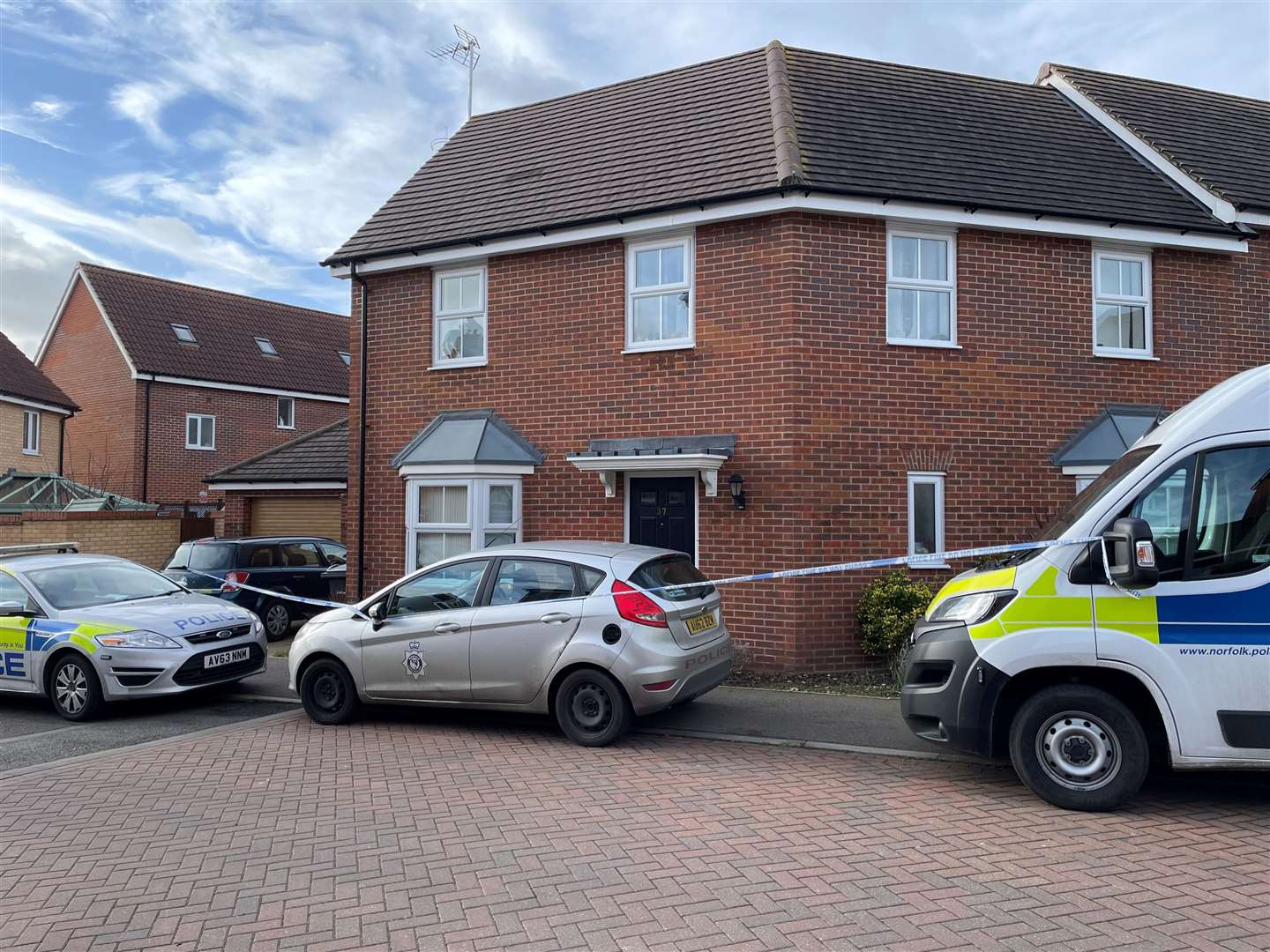 A police cordon remained in place on Monday with a number of marked police vehicles at the scene (Sam Russell/PA)